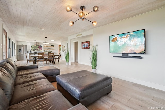 8940 S Brandenburger Dr, Morrison, CO 80465 - living area featuring light wood-type flooring, a chandelier, wood ceiling, and recessed lighting