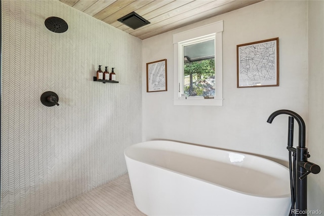 8940 S Brandenburger Dr, Morrison, CO 80465 - full bath with wooden ceiling, a freestanding tub, and tiled shower