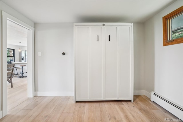 8940 S Brandenburger Dr, Morrison, CO 80465 - mudroom with baseboard heating and light wood-type flooring