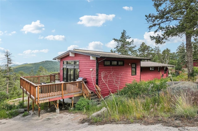 8940 S Brandenburger Dr, Morrison, CO 80465 - view of side of property featuring a deck with mountain view