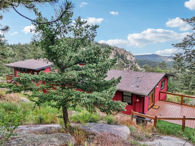 8940 S Brandenburger Dr, Morrison, CO 80465 - view of front of property with roof with shingles and a deck with mountain view