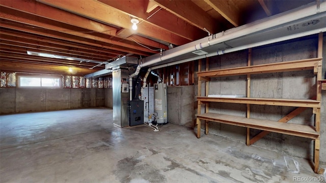 basement featuring gas water heater and heating unit