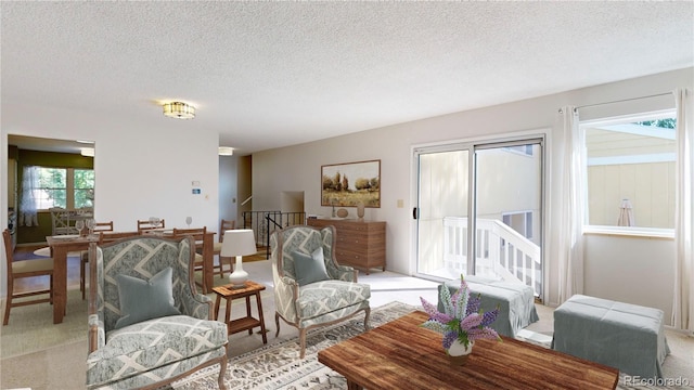 living room featuring light colored carpet and a textured ceiling