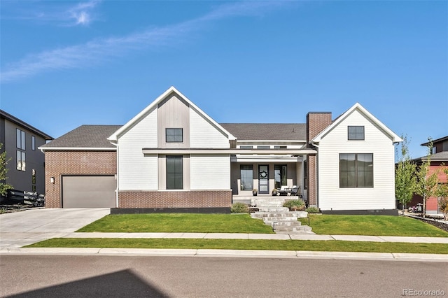 6589 Canyonpoint Rd, Castle Pines, CO 80108 - modern farmhouse style home with a porch, an attached garage, a front lawn, and driveway