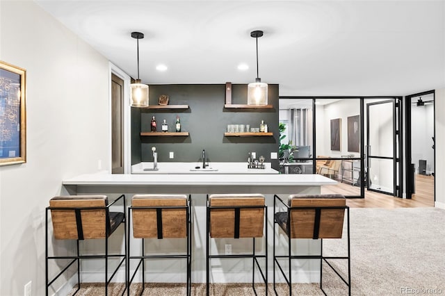 6589 Canyonpoint Rd, Castle Pines, CO 80108 - bar with recessed lighting, wet bar, pendant lighting, and a sink
