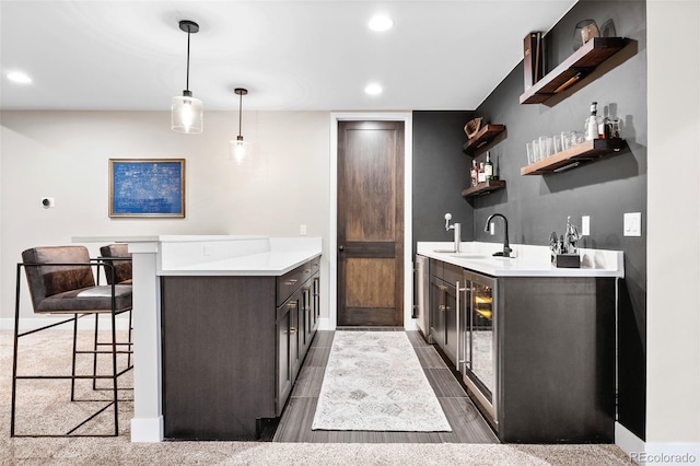 6589 Canyonpoint Rd, Castle Pines, CO 80108 - bar with a sink, wet bar, baseboards, recessed lighting, and decorative light fixtures