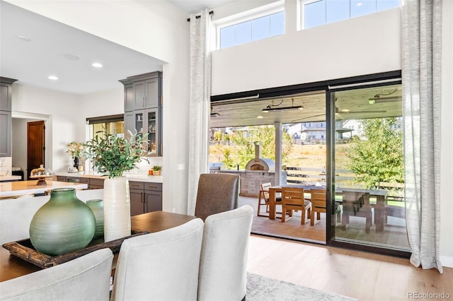 6589 Canyonpoint Rd, Castle Pines, CO 80108 - dining space featuring light wood finished floors and recessed lighting