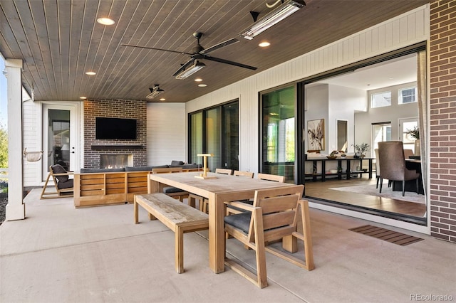 6589 Canyonpoint Rd, Castle Pines, CO 80108 - view of patio with outdoor dining area, an outdoor living space with a fireplace, and ceiling fan