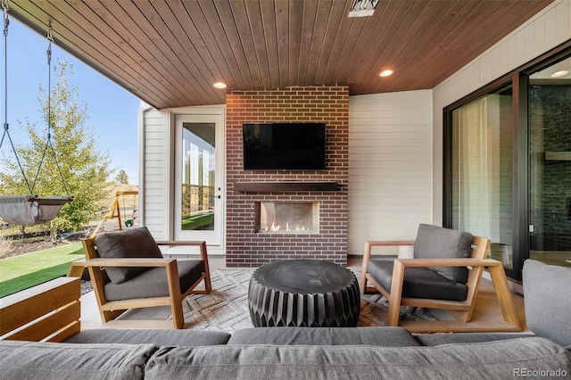 6589 Canyonpoint Rd, Castle Pines, CO 80108 - view of patio / terrace featuring an outdoor living space with a fireplace
