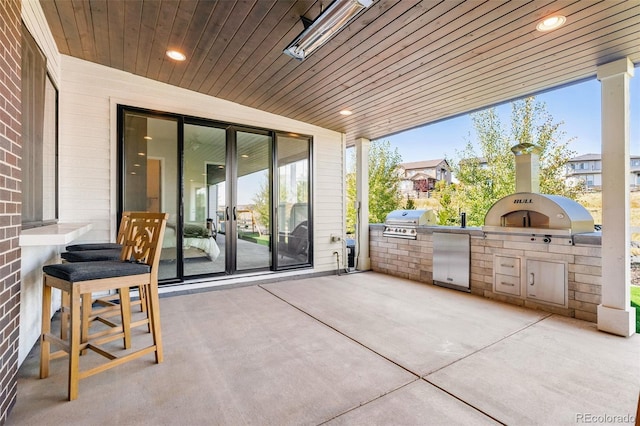 6589 Canyonpoint Rd, Castle Pines, CO 80108 - view of patio / terrace featuring exterior kitchen, french doors, and a grill