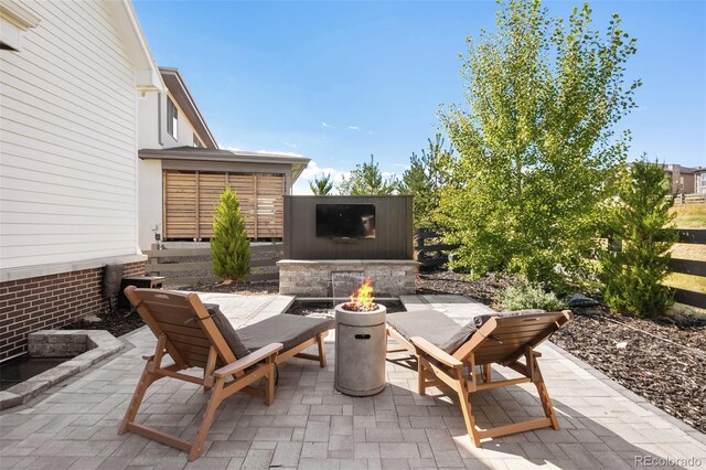 6589 Canyonpoint Rd, Castle Pines, CO 80108 - view of patio featuring an outdoor fire pit