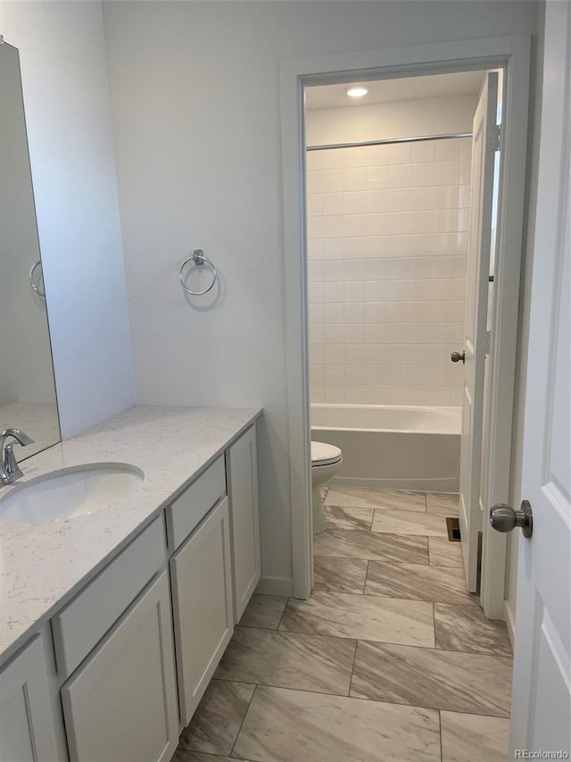 bathroom featuring toilet and vanity