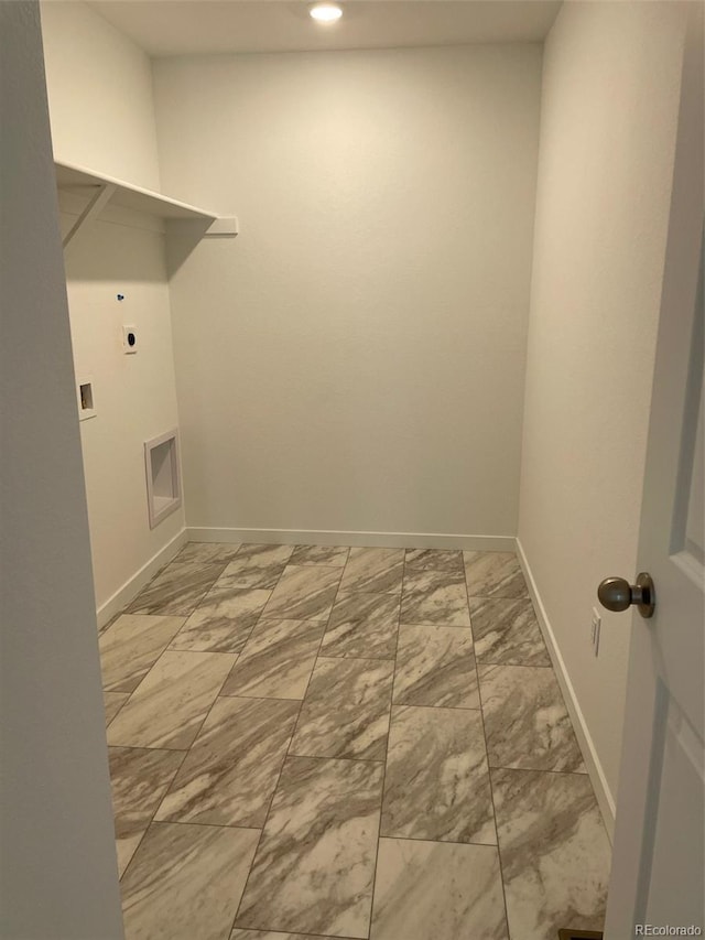 laundry room featuring laundry area, baseboards, marble finish floor, and electric dryer hookup