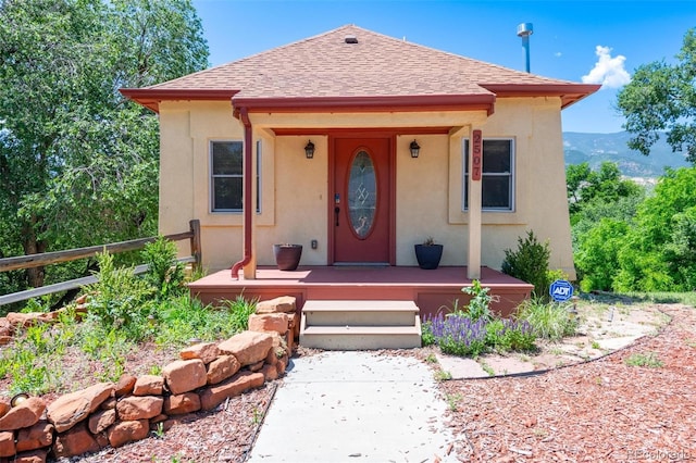 2507 W Kiowa St, Colorado Springs, CO 80904 - bungalow-style home featuring stucco siding and roof with shingles