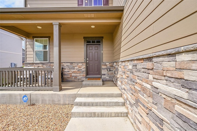 7465 E 157th Pl, Thornton, CO 80602 - entrance to property featuring stone siding and covered porch