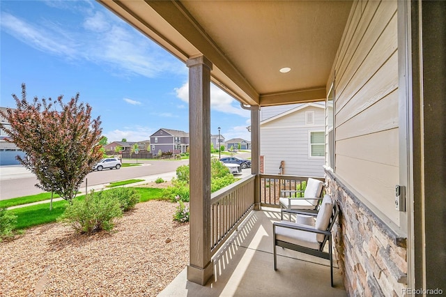 7465 E 157th Pl, Thornton, CO 80602 - view of patio / terrace featuring covered porch and a residential view