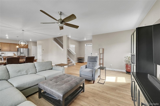 7465 E 157th Pl, Thornton, CO 80602 - living area with recessed lighting, stairway, a ceiling fan, light wood-type flooring, and baseboards