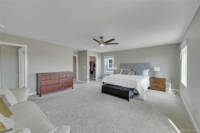 7465 E 157th Pl, Thornton, CO 80602 - carpeted bedroom featuring a spacious closet, a closet, baseboards, and a ceiling fan
