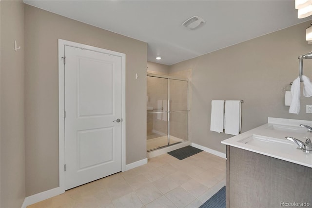 7465 E 157th Pl, Thornton, CO 80602 - full bath featuring a stall shower, baseboards, tile patterned flooring, and vanity