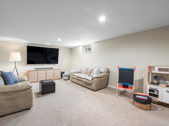 living area featuring carpet flooring, baseboards, and recessed lighting