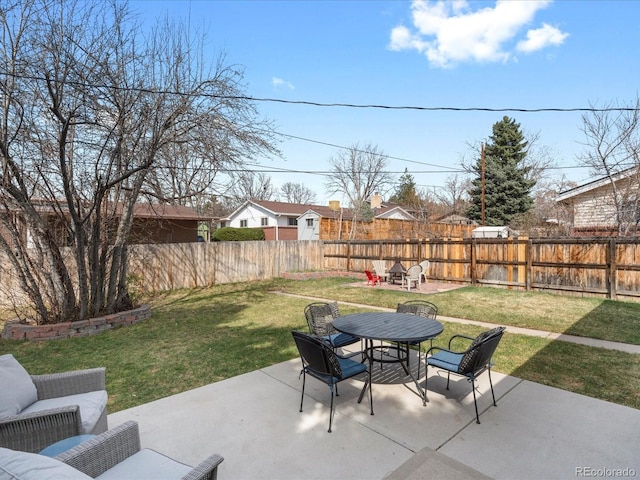 view of patio with an outdoor living space, outdoor dining area, and a fenced backyard