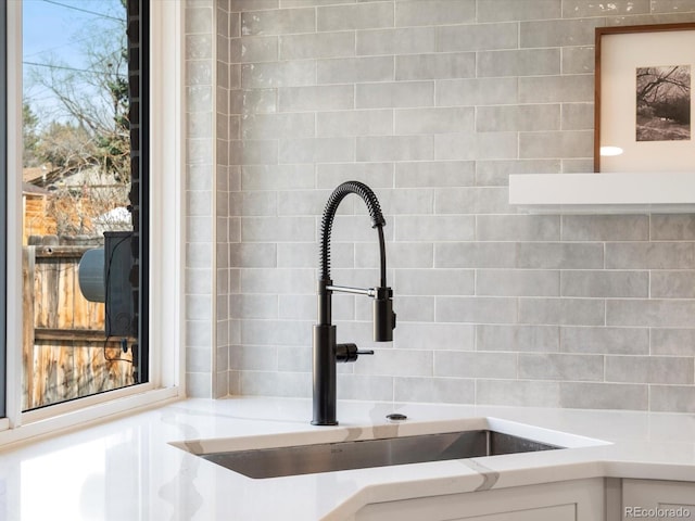 room details with white cabinets and a sink