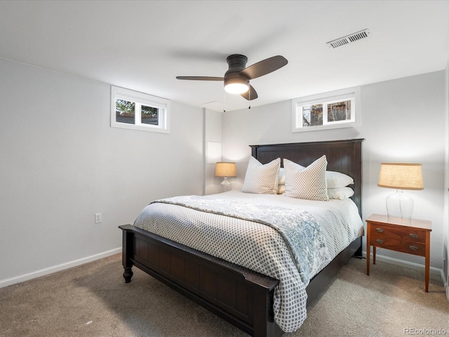 bedroom with baseboards, carpet flooring, visible vents, and a ceiling fan