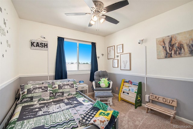 bedroom featuring light colored carpet, ceiling fan, and baseboards