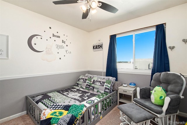 bedroom with ceiling fan, carpet, and baseboards