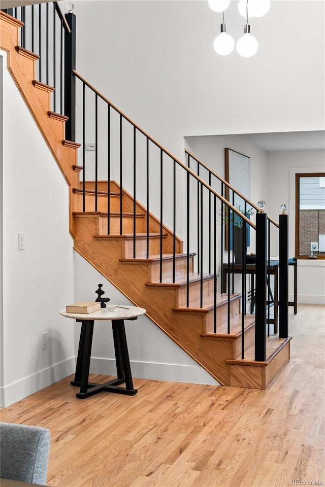 stairs featuring hardwood / wood-style flooring