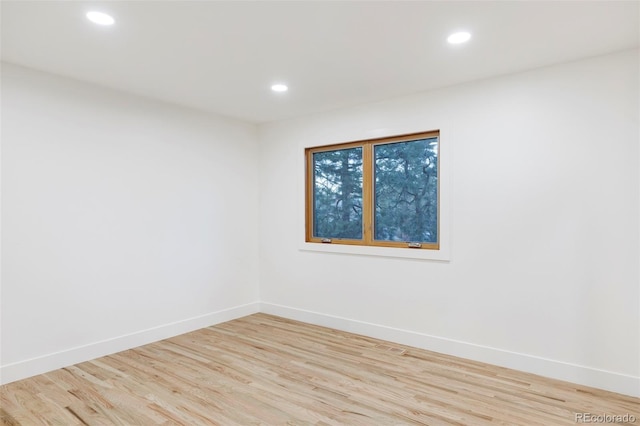 spare room featuring light hardwood / wood-style flooring