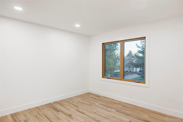 spare room with light wood-type flooring