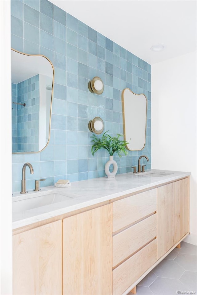 bathroom featuring vanity, tasteful backsplash, tile patterned floors, and tile walls