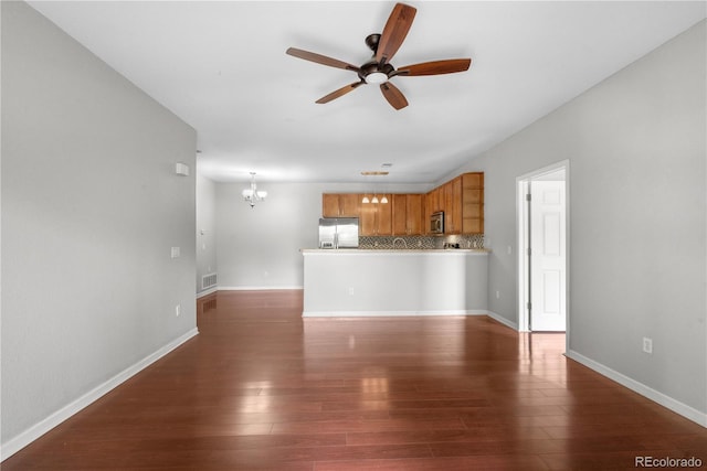 23456 E 5th Pl Unit 104, Aurora, CO 80018 - unfurnished living room with a chandelier, ceiling fan, and dark wood finished floors