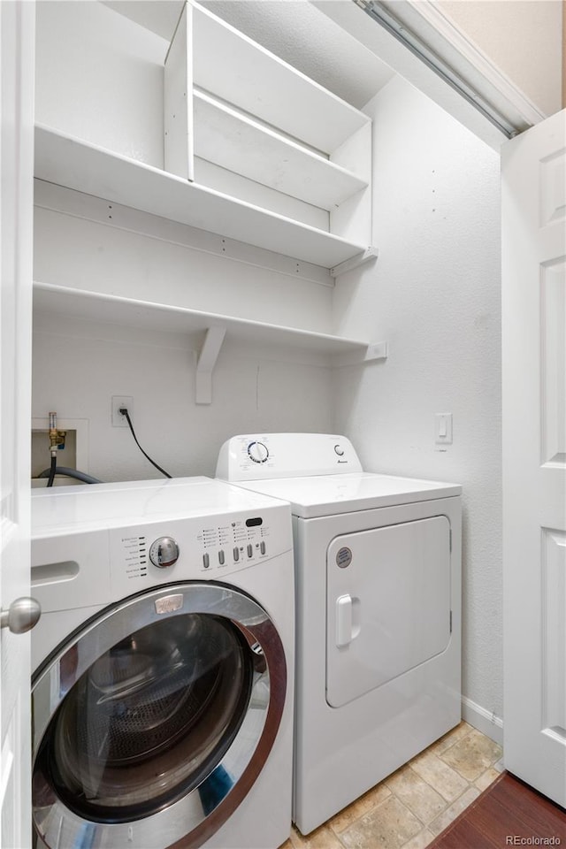 23456 E 5th Pl Unit 104, Aurora, CO 80018 - laundry room with washing machine and dryer