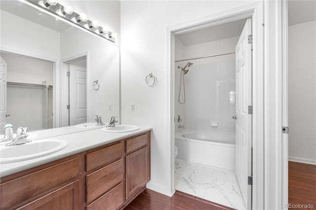 23456 E 5th Pl Unit 104, Aurora, CO 80018 - bathroom with double vanity,  shower combination, and marble finish floors