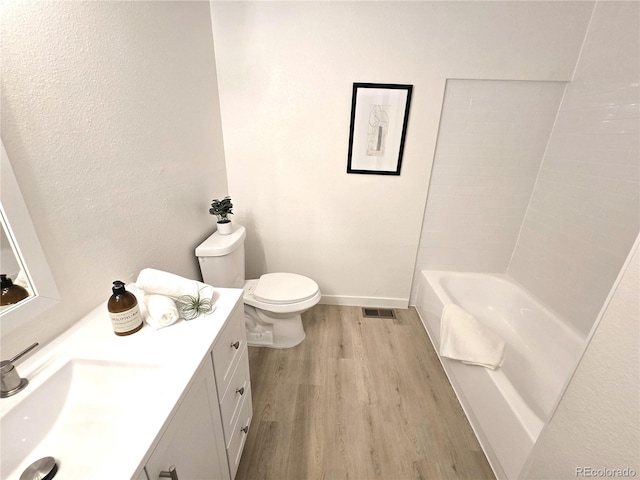 5721 W 92nd Ave Unit 66, Westminster, CO 80031 - full bath with wood finished floors, toilet, vanity, and baseboards