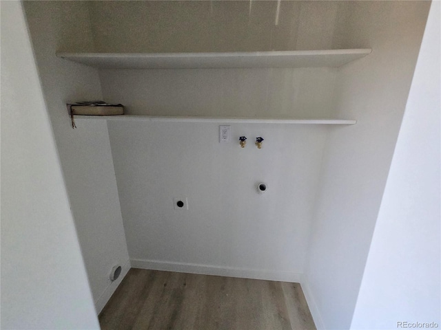 5721 W 92nd Ave Unit 66, Westminster, CO 80031 - laundry area featuring electric dryer hookup, hookup for a washing machine, and light wood-type flooring