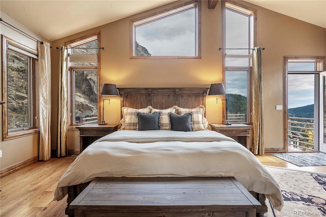 187 Fox Ridge Dr, Evergreen, CO 80439 - bedroom with a mountain view, light hardwood / wood-style flooring, and vaulted ceiling