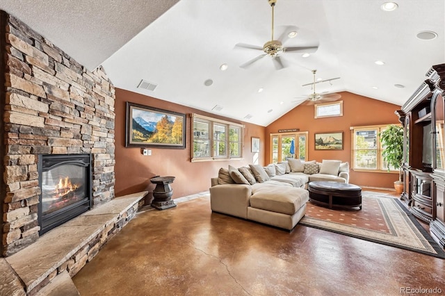 living room with ceiling fan, a fireplace, a textured ceiling, and vaulted ceiling