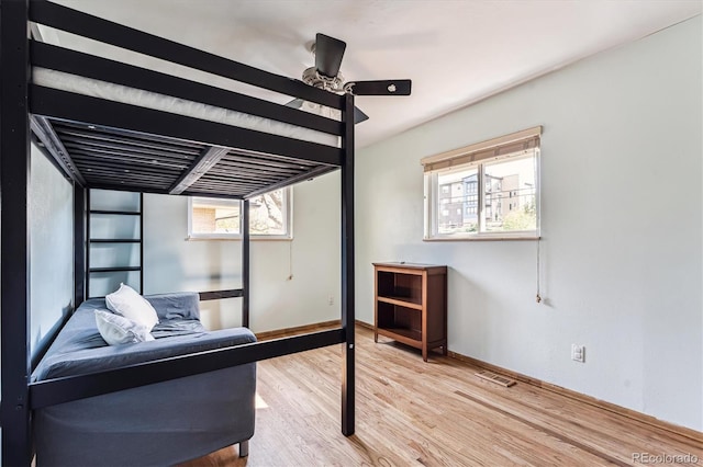 bedroom featuring light hardwood / wood-style flooring and ceiling fan