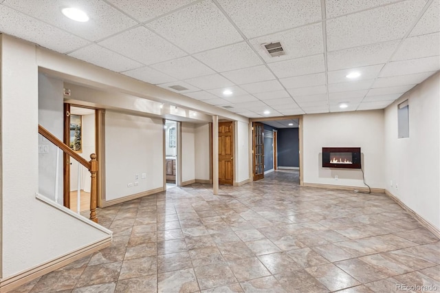 basement featuring a drop ceiling