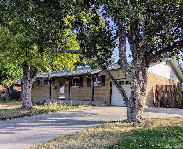 ranch-style house featuring a garage