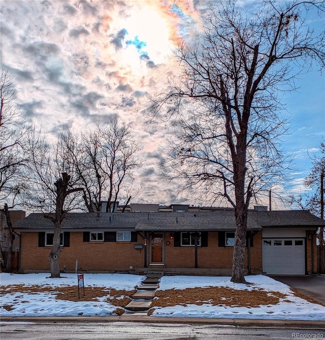 ranch-style house featuring a garage