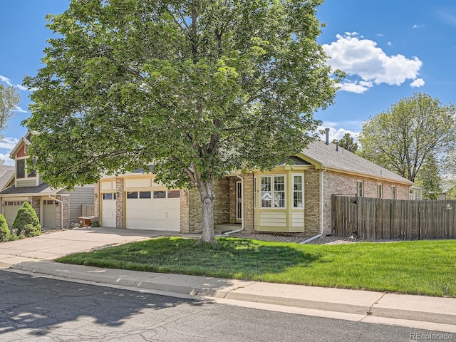 obstructed view of property featuring brick siding, concrete driveway, and a garage