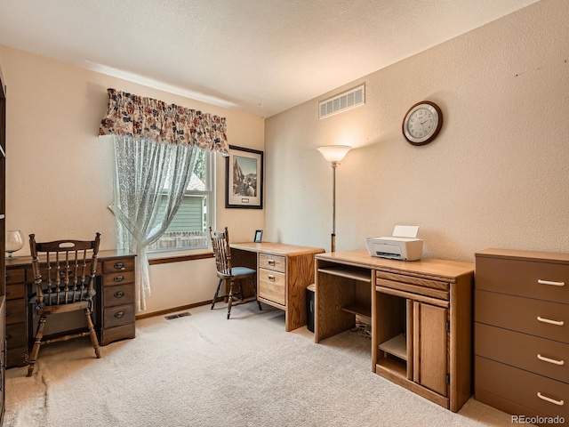 office space with light colored carpet and baseboards