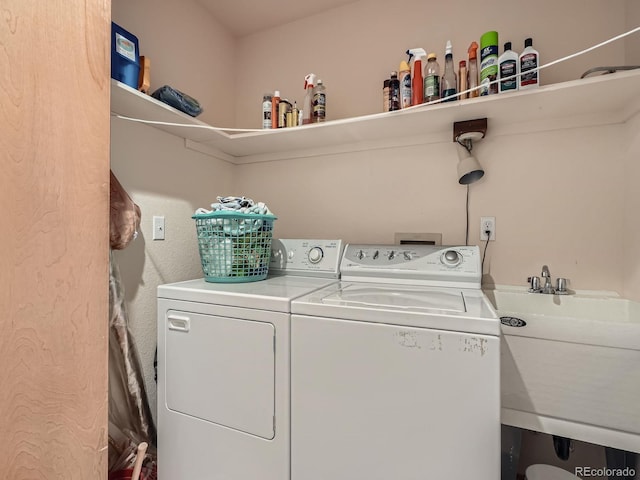 laundry room featuring separate washer and dryer