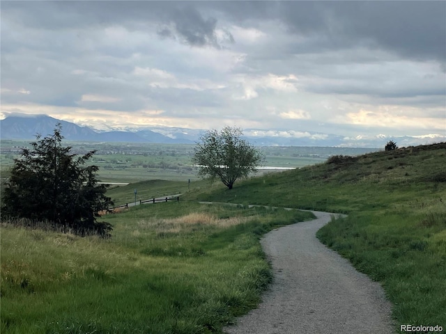 view of home's community with a rural view and a mountain view