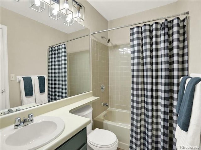 full bathroom featuring shower / bath combo, vanity, and toilet