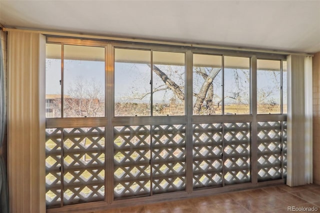 doorway to outside featuring tile patterned floors